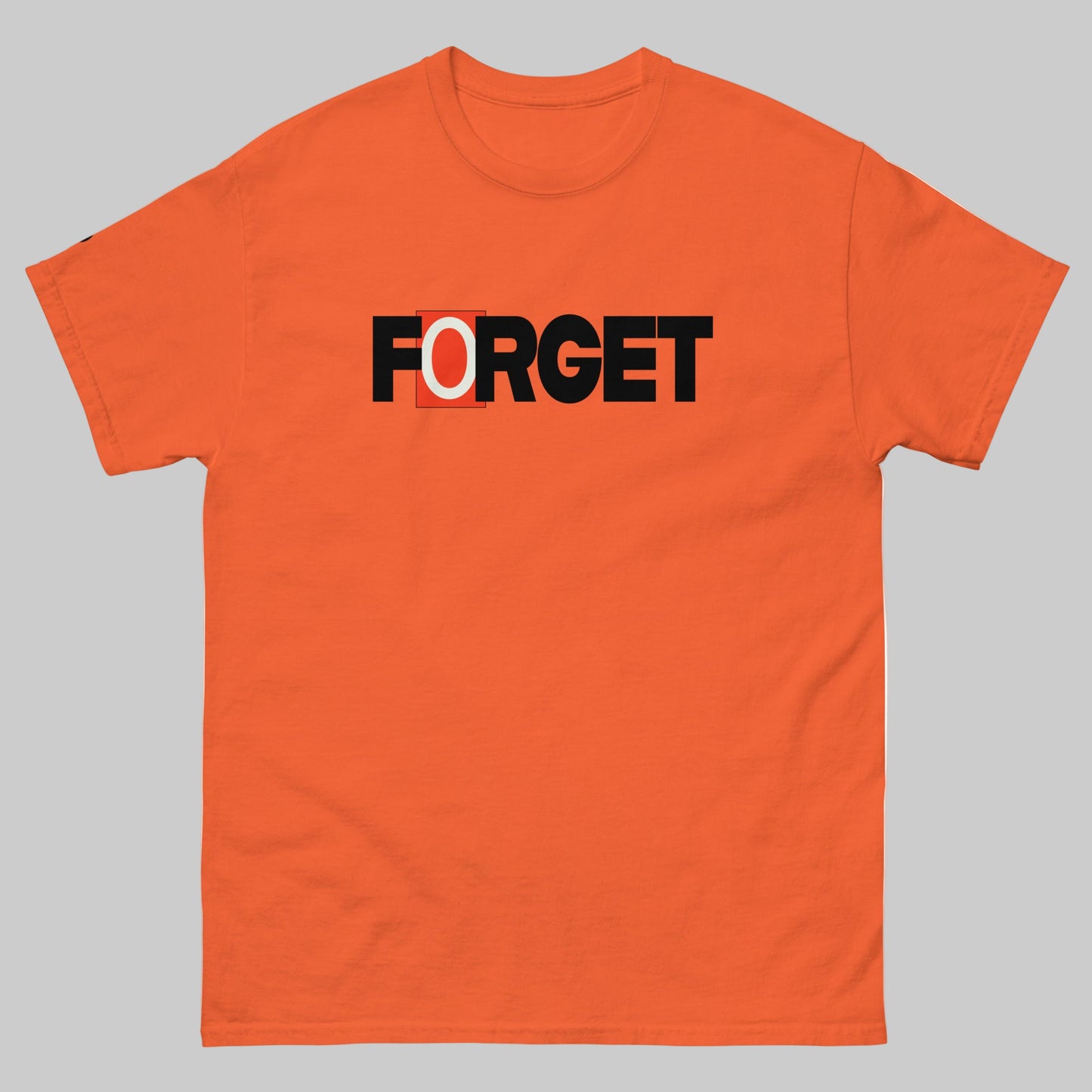 TrapCrackshots FORGET T-shirt Orange– clay shooting shirt for men and women. Encourages shooters to forget misses and focus on the next target, emphasizing progress and mindset.